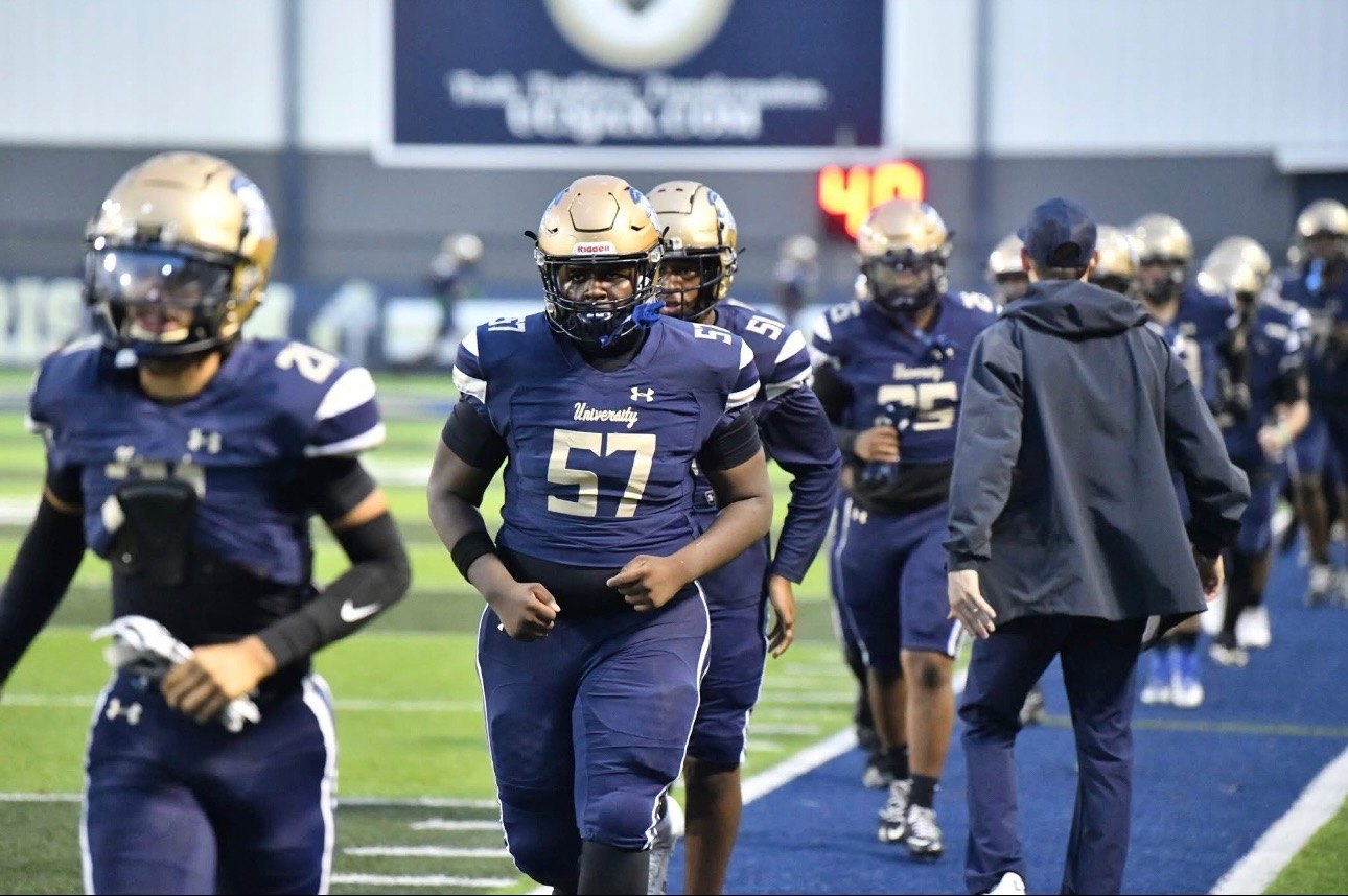 Kayden Hamilton walking from sideline
