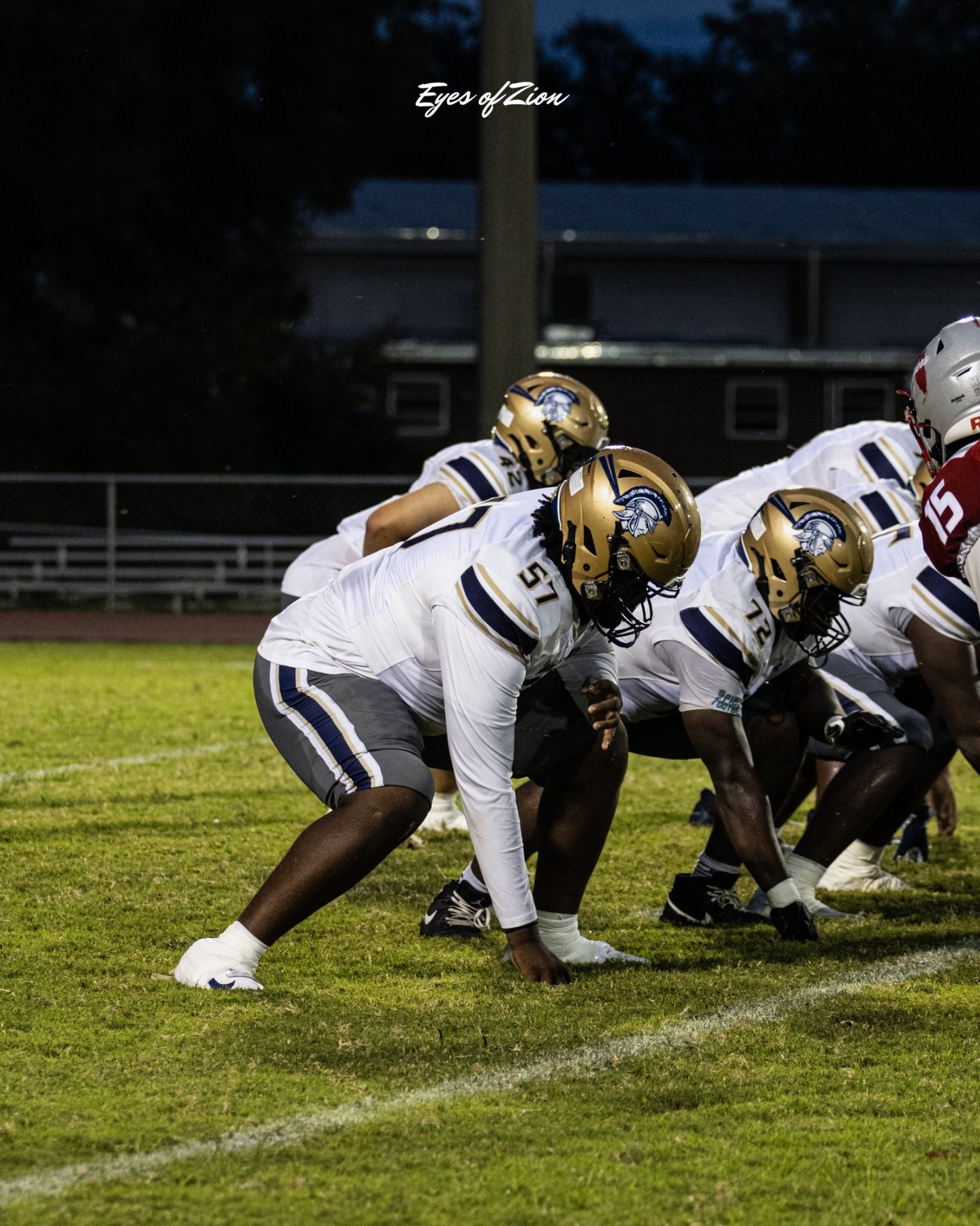 Kayden Hamilton in stance wearing white uniform
